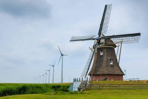 Old Windmill And New Wind Turbines